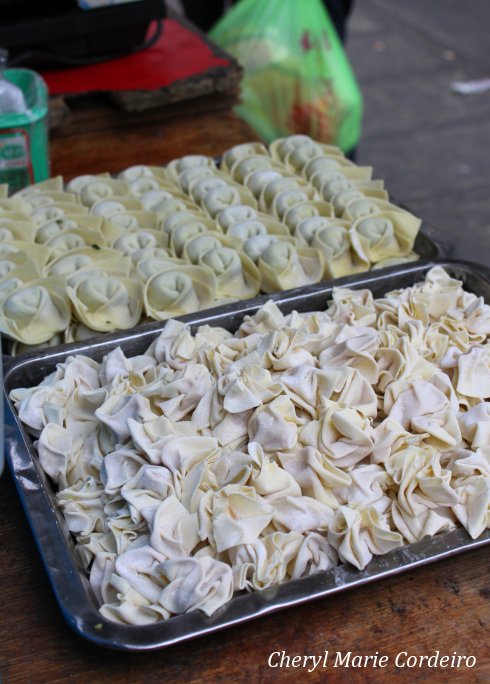 Hand folded dumplings, Yuyuan, Shanghai 2011.